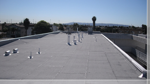 Completed 4-ply capsheet roofing system, all flashings are coated with fibrous
aluminum